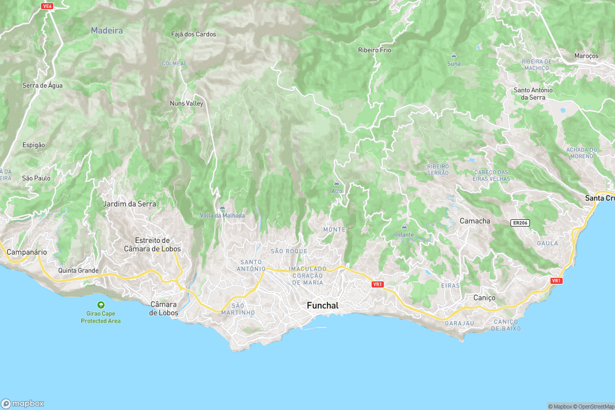 North-up street map of Madeira’s southeast coast showing the area around the airport in Santa Cruz, Funchal and the coast toward Praia Formosa, with basemap labels and roads.
